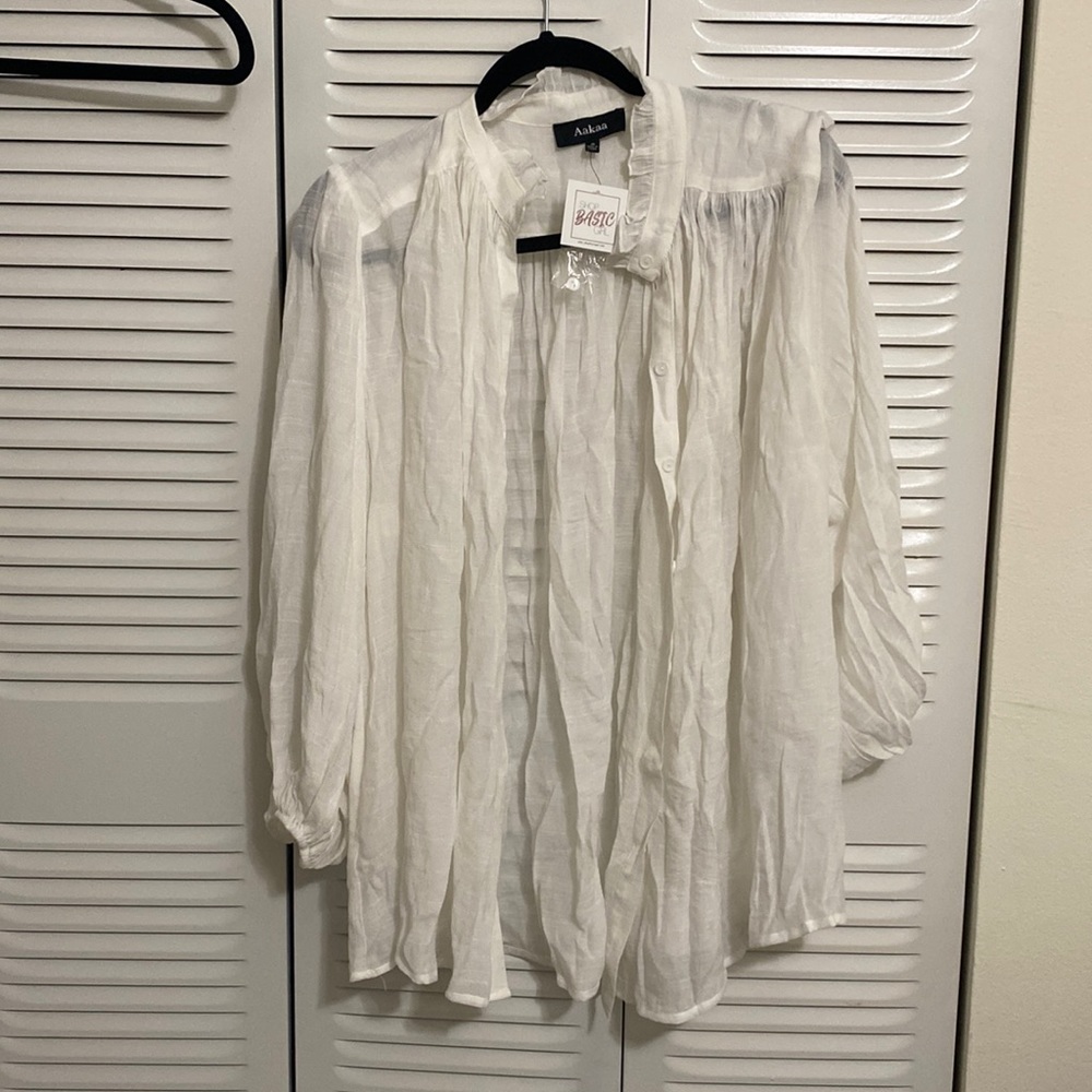 White beach cover up or can use as a top